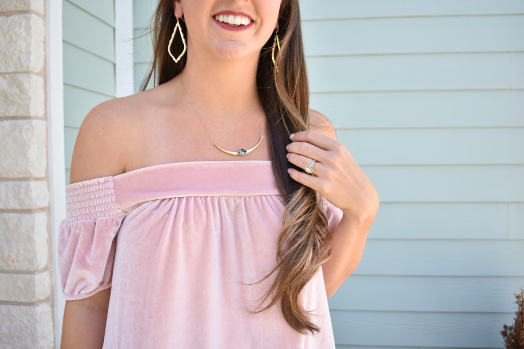 pink velvet off the shoulder top with dainty necklace and kendra scott earrings
