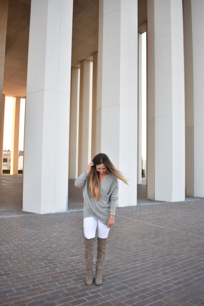 Grey wrap sweater with white jeans and over the knee boots