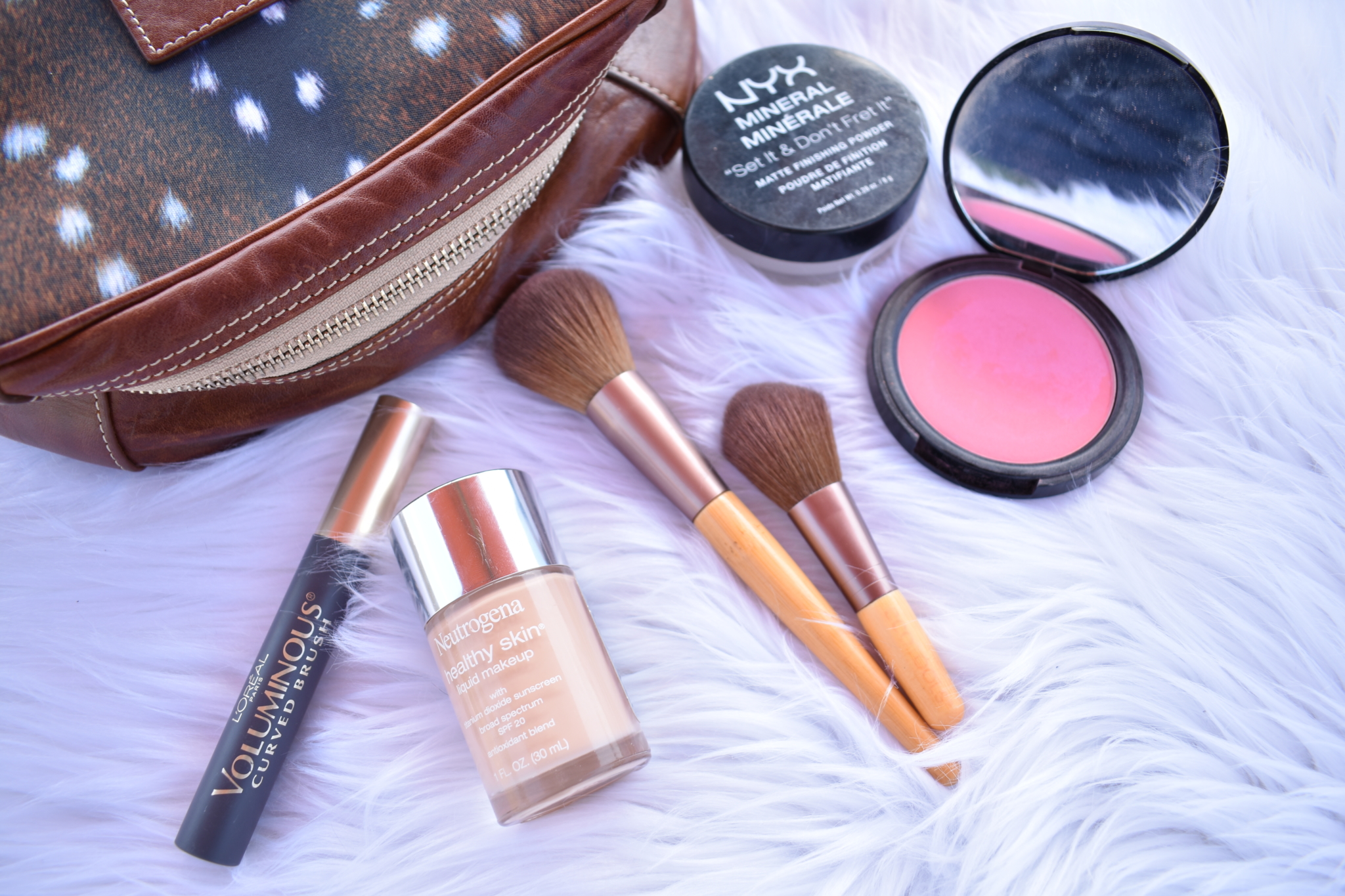 makeup bag, Loreal mascara, makeup brushes, neutrogena foundation, nyx blush and mineral powder